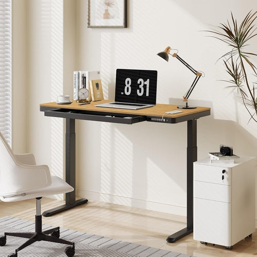Sleek black standing desk showing electric height adjustment mechanism