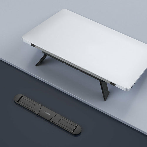 Portable laptop stand folded with sleek aluminum design by DeskCraft