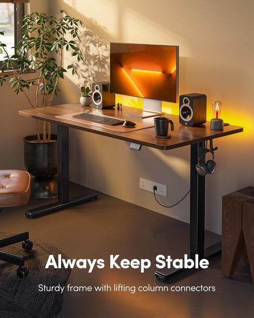 Close-up of electric height adjustment controls on modern standing desk