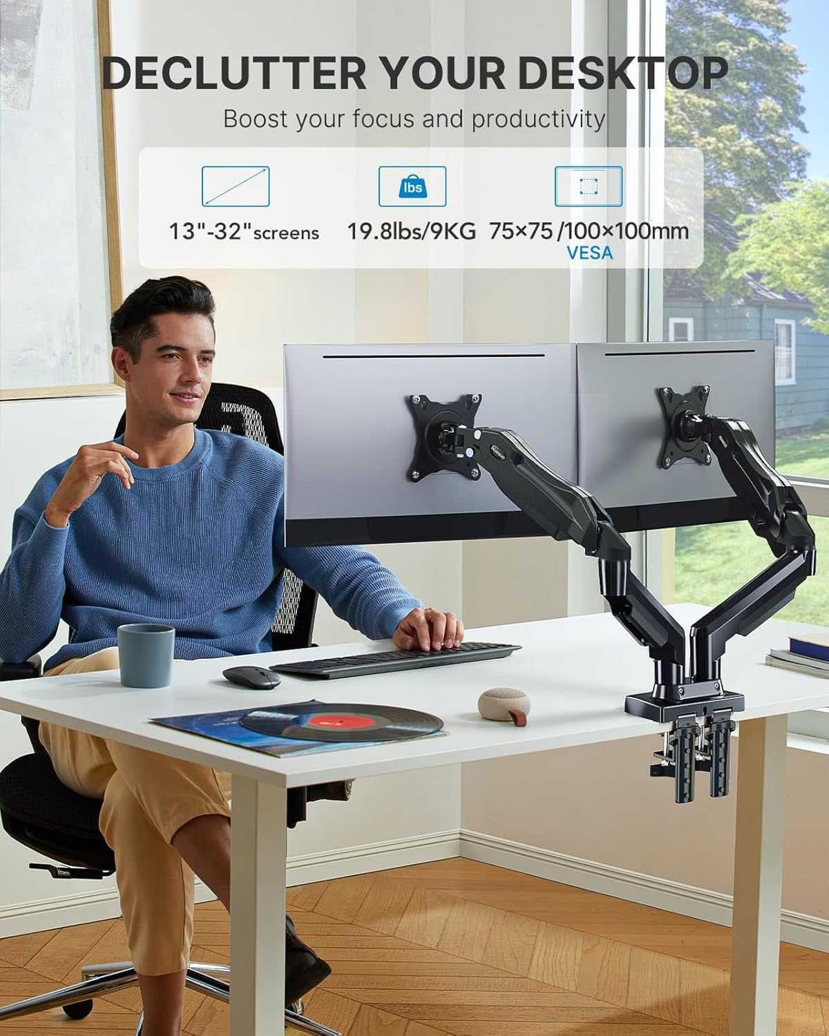 Dual monitor arm installed on modern desk setup with sleek design